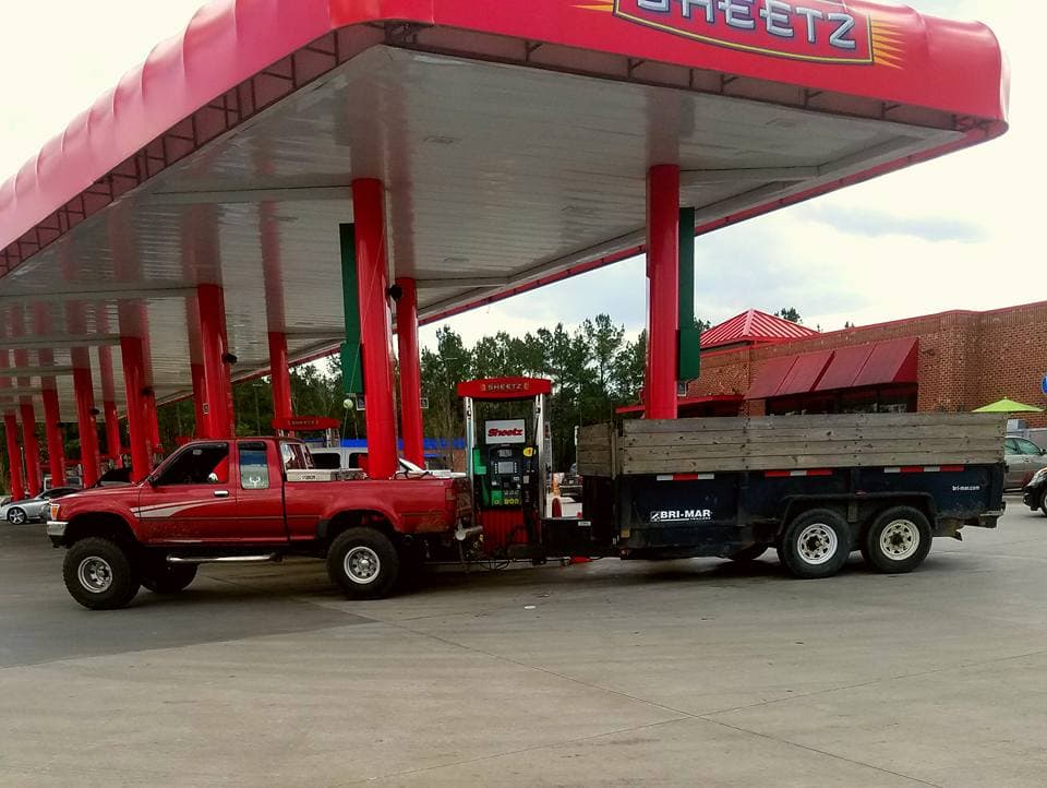 My first “real” rig — that little Toyota pulling a trailer way too big for it, but we were making it happen. Every haul was one more step toward the dream.