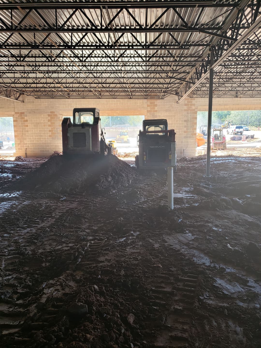 We spent days undercutting bad soils and refilling the site with suitable material to prep for the concrete slab. Long days, muddy boots, but lessons I still carry today.