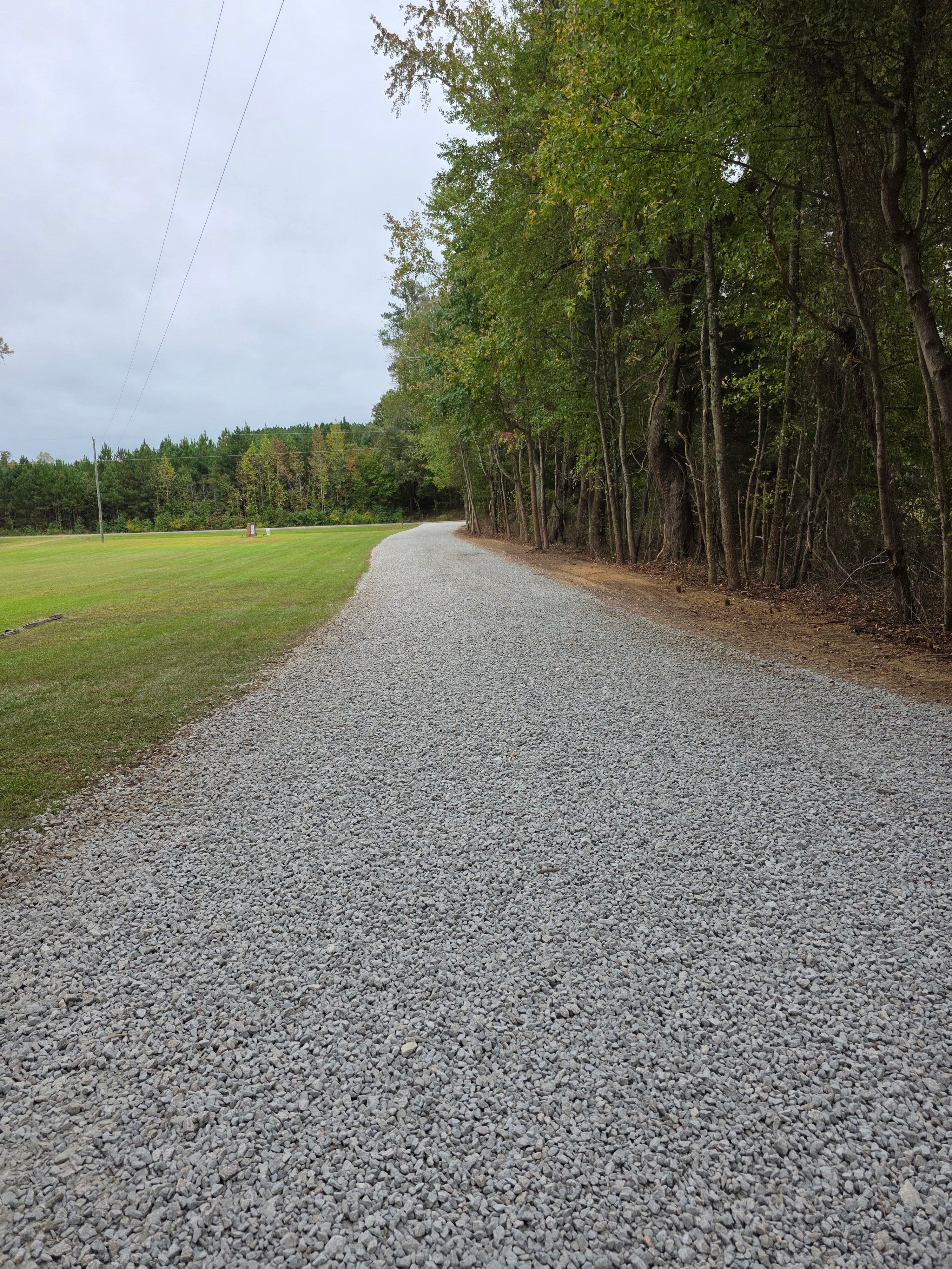 Finished gravel driveway at church in oxford nc after grading and stone installation